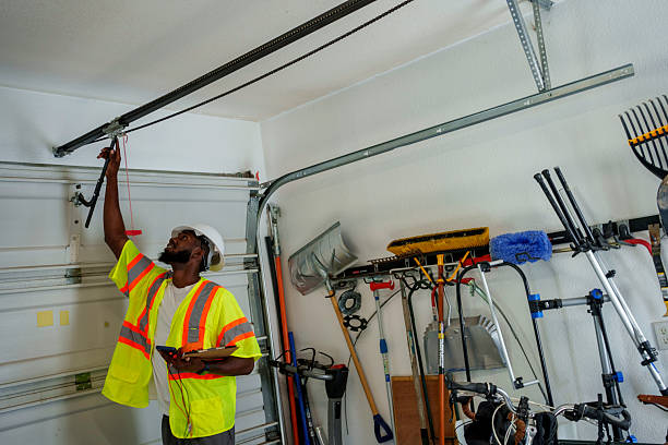 Professional Garage Door Panel Replacement technician working in El Cerro Mission, NM